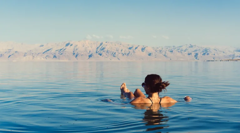 Person floating effortlessly on the Dead Sea